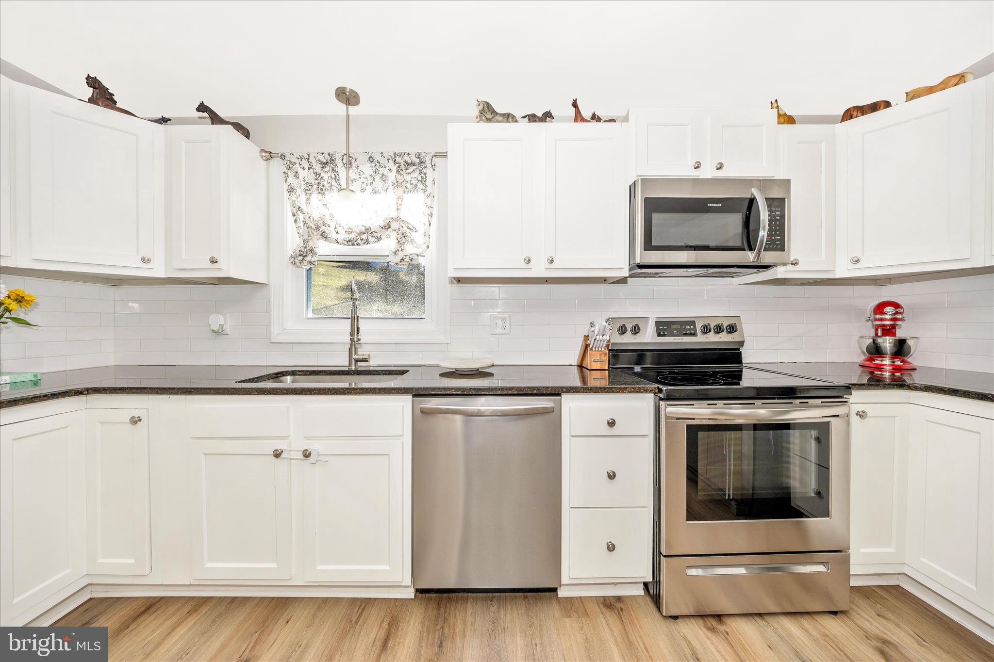 11863 Wolfsville Road Smithsburg, MD 21783 - Photo 13 of 51 a kitchen with stainless steel appliances granite countertop a sink and a microwave