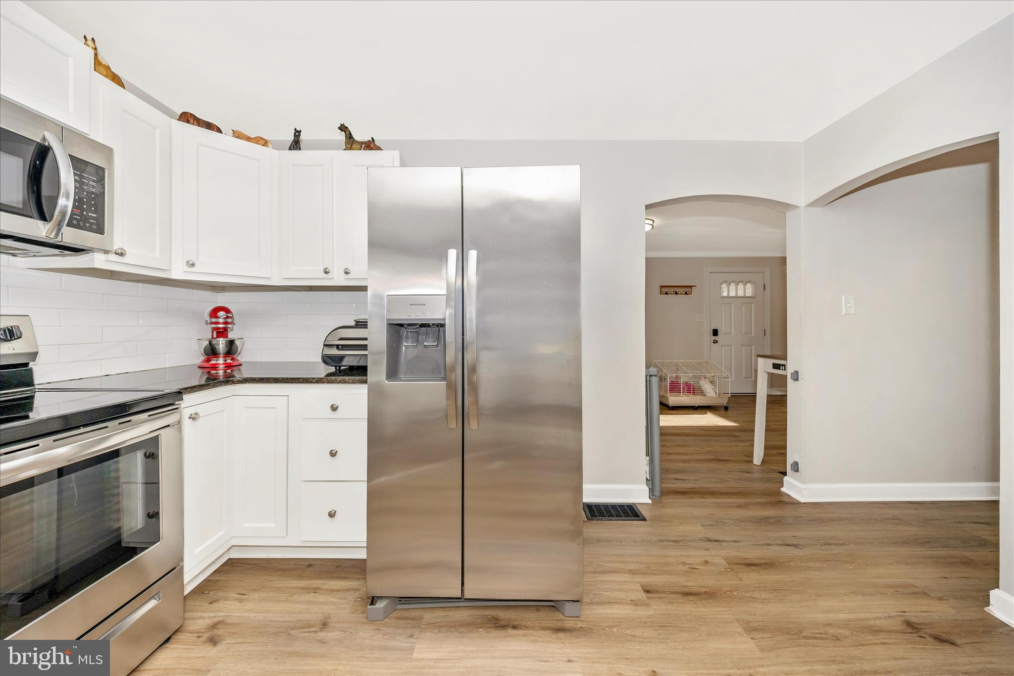11863 Wolfsville Road Smithsburg, MD 21783 - Photo 14 of 51 a kitchen with stainless steel appliances granite countertop a refrigerator and a stove top oven
