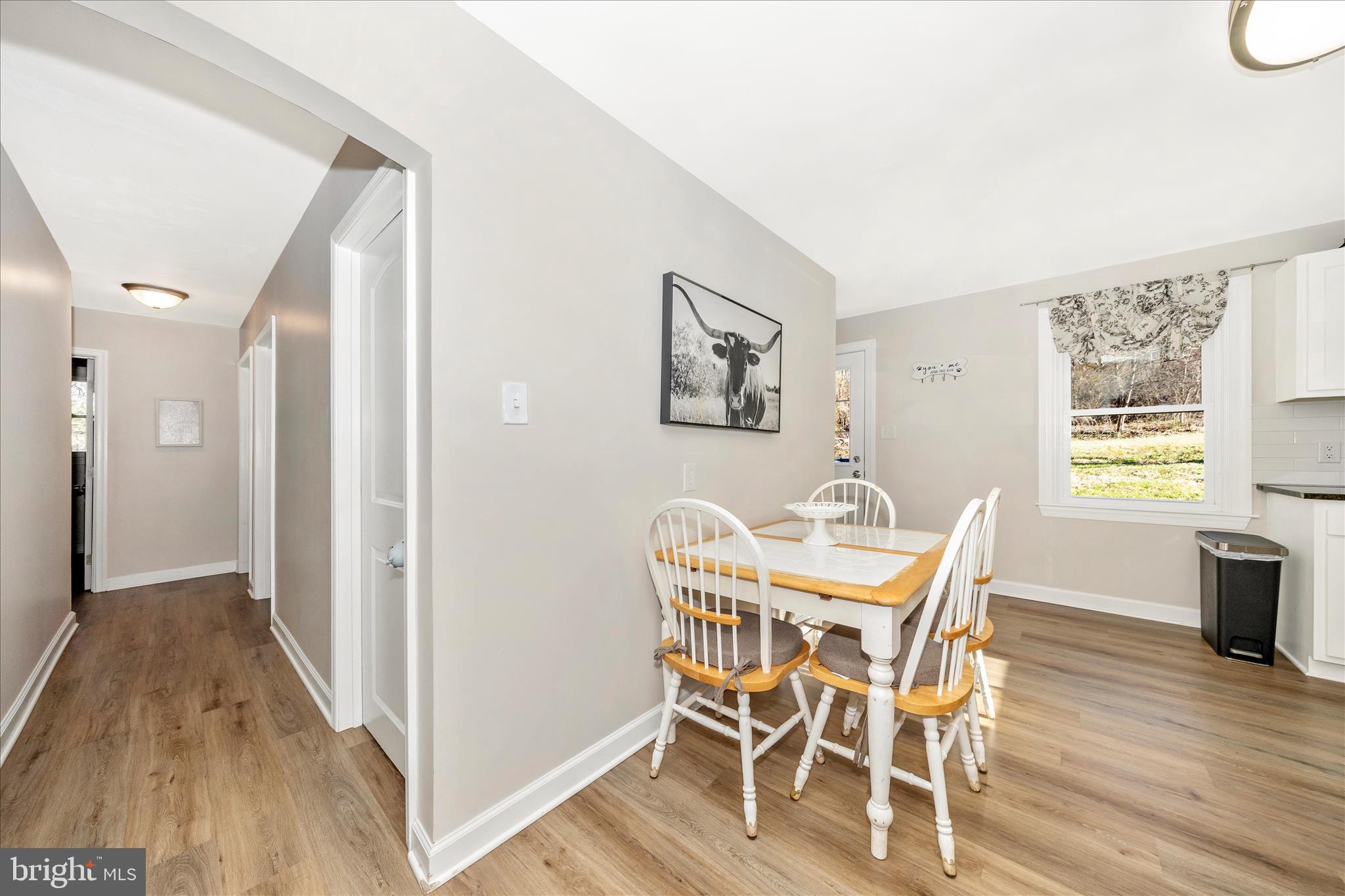 11863 Wolfsville Road Smithsburg, MD 21783 - Photo 15 of 51 a view of a dining room with furniture and wooden floor