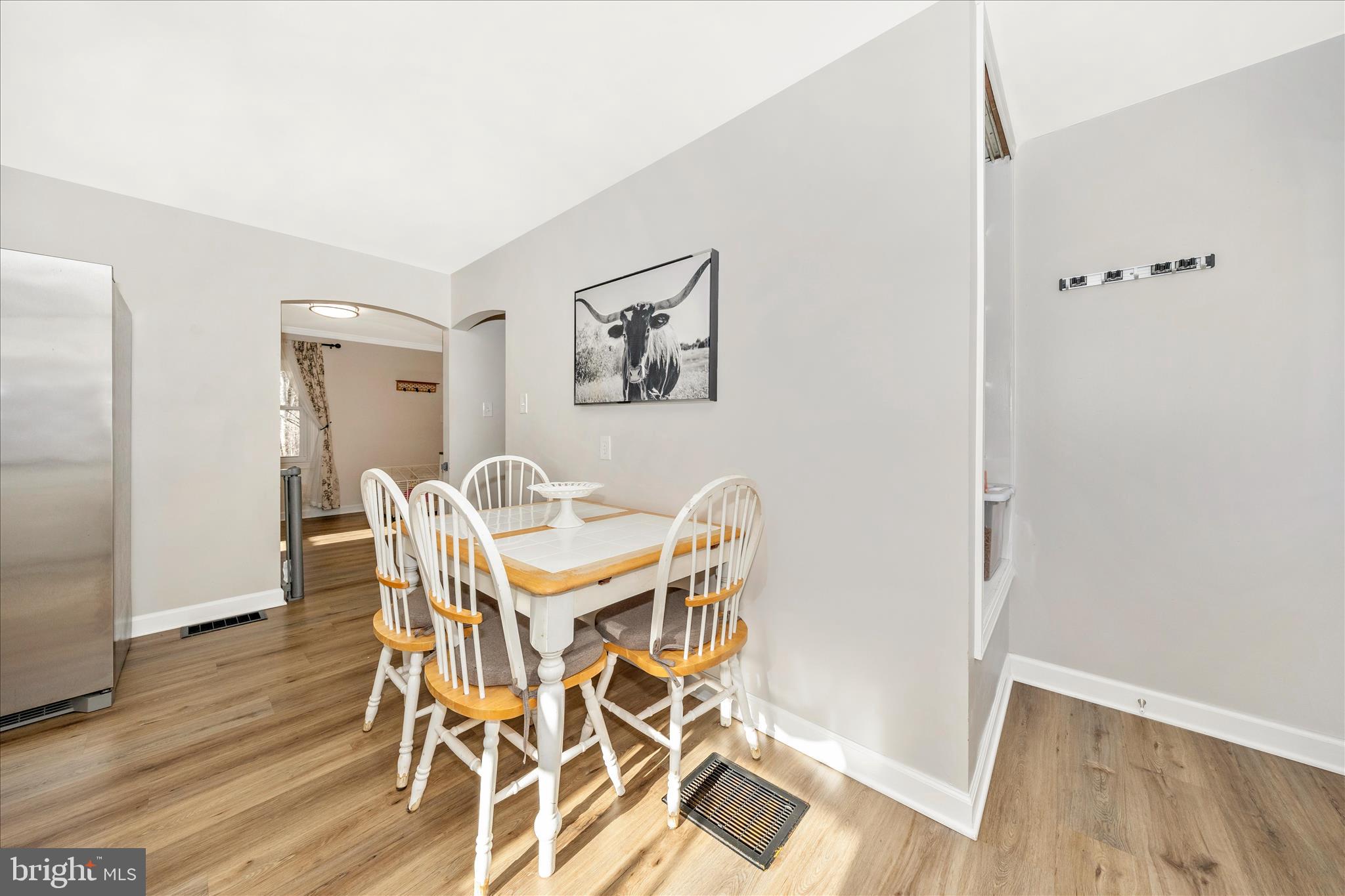11863 Wolfsville Road Smithsburg, MD 21783 - Photo 17 of 51 a view of a dining room with furniture and wooden floor