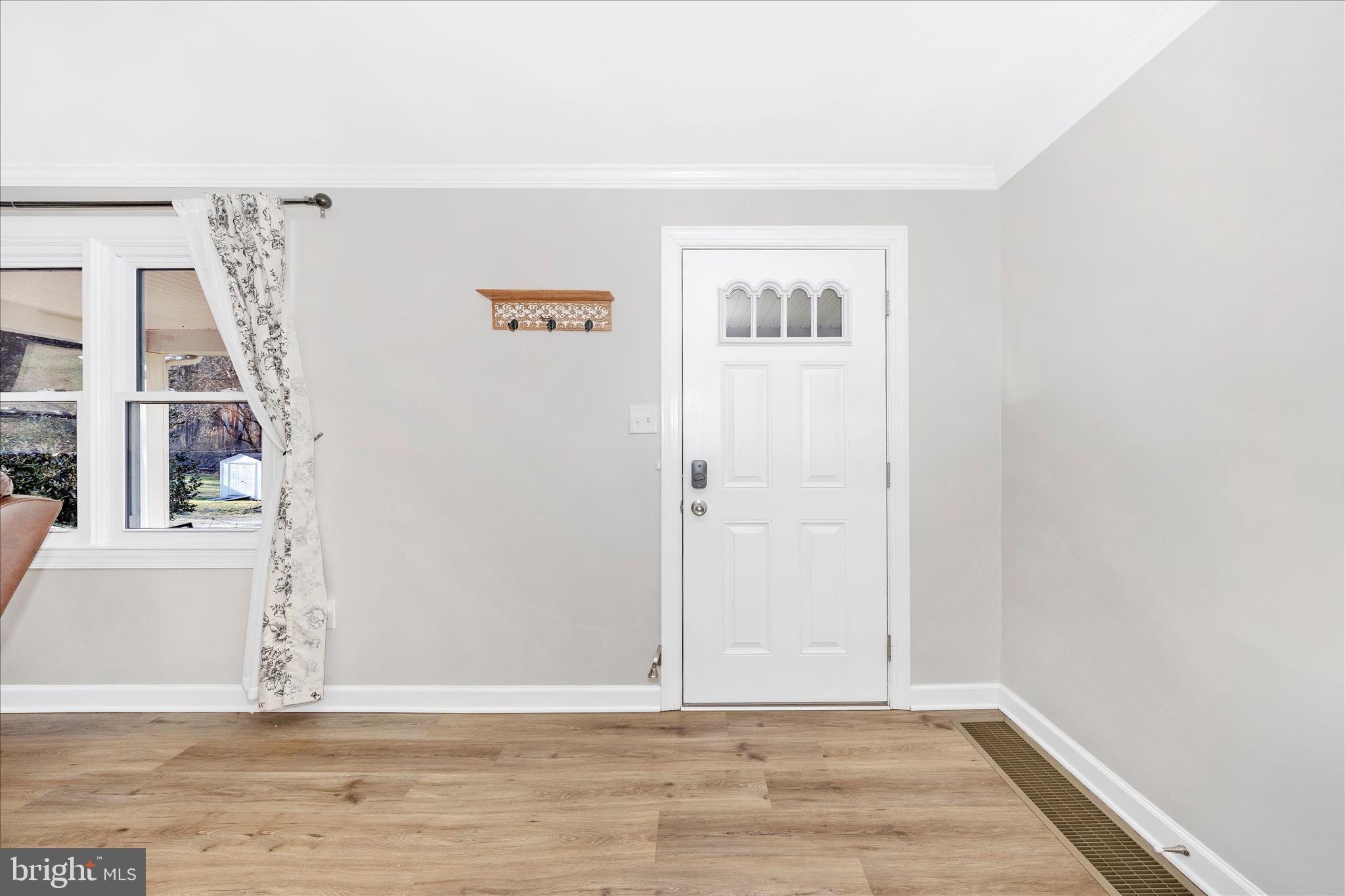11863 Wolfsville Road Smithsburg, MD 21783 - Photo 2 of 51 a view of a livingroom with wooden floor and a window