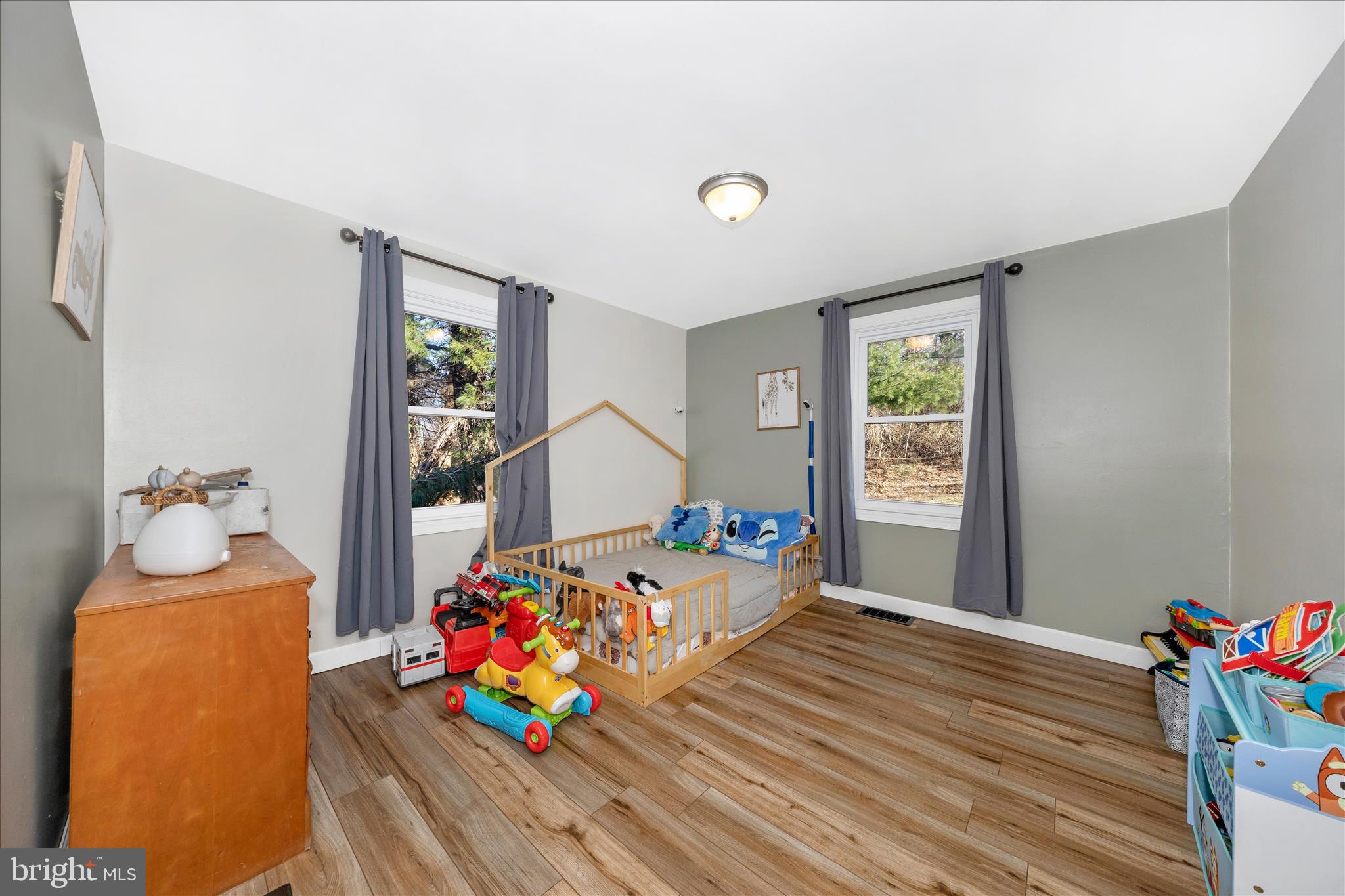 11863 Wolfsville Road Smithsburg, MD 21783 - Photo 22 of 51 a bedroom with furniture and a wooden floor
