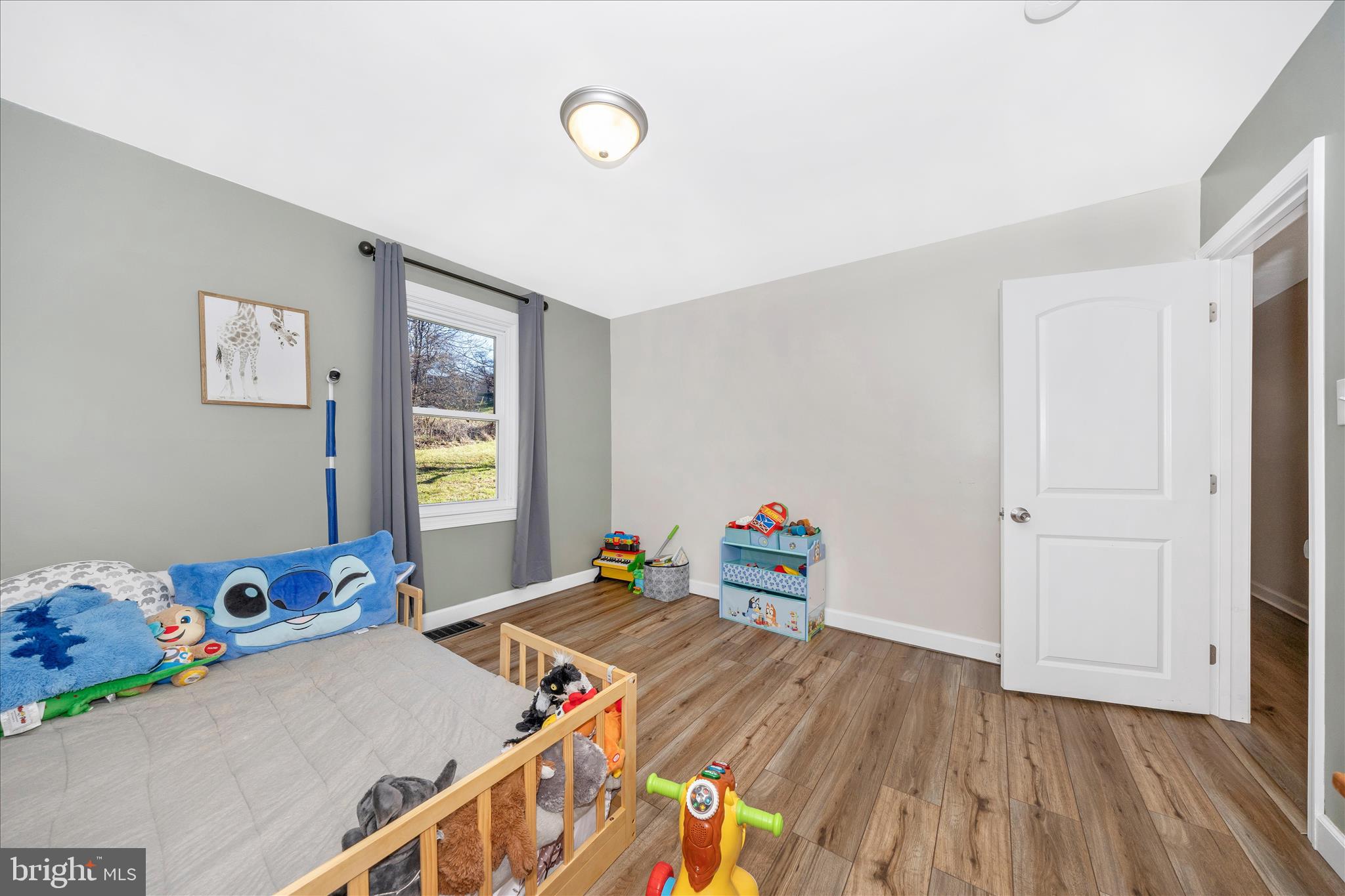 11863 Wolfsville Road Smithsburg, MD 21783 - Photo 23 of 51 a bedroom with bed and wooden floor