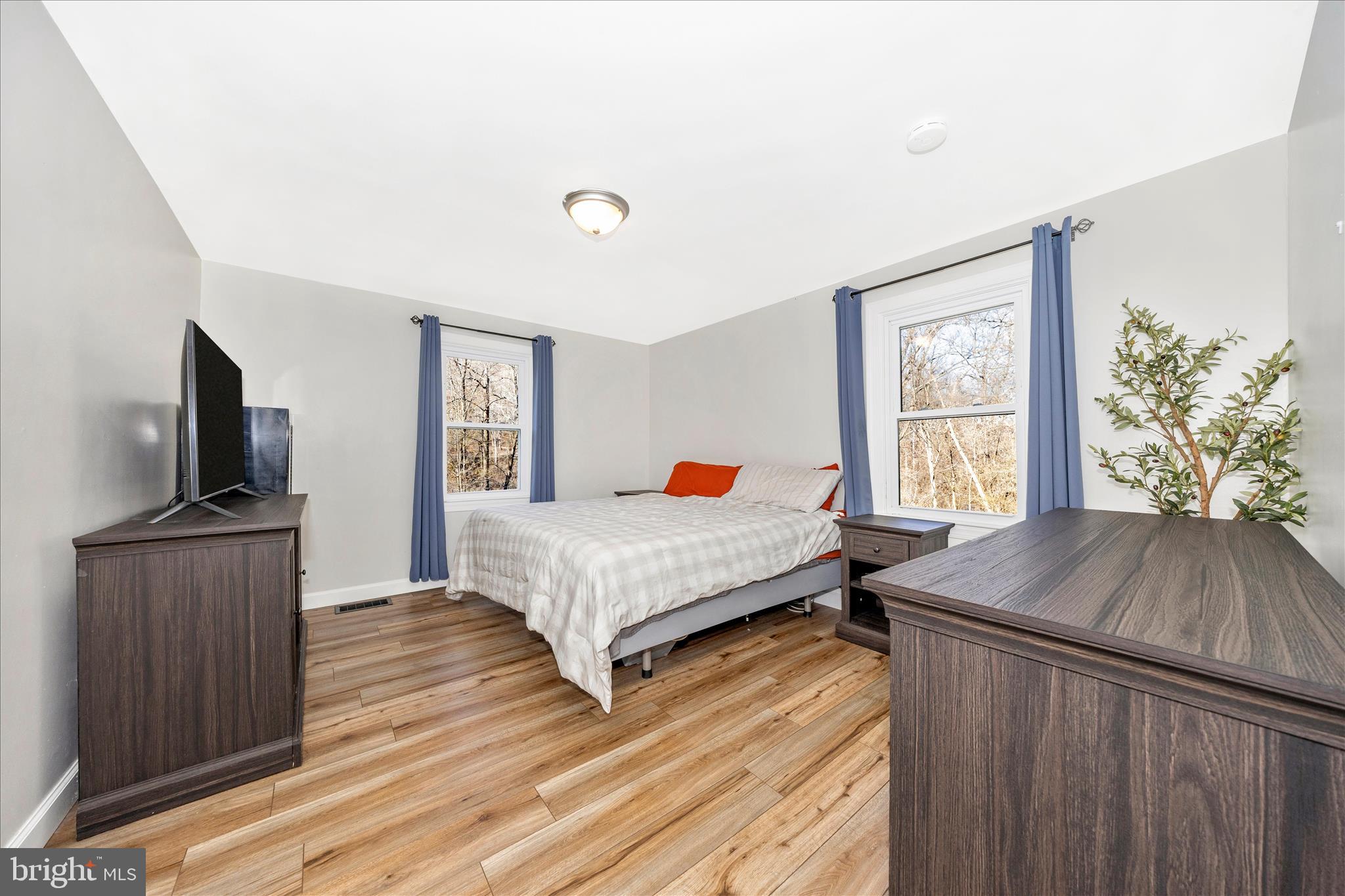 11863 Wolfsville Road Smithsburg, MD 21783 - Photo 26 of 51 a bedroom with a bed and a flat screen tv