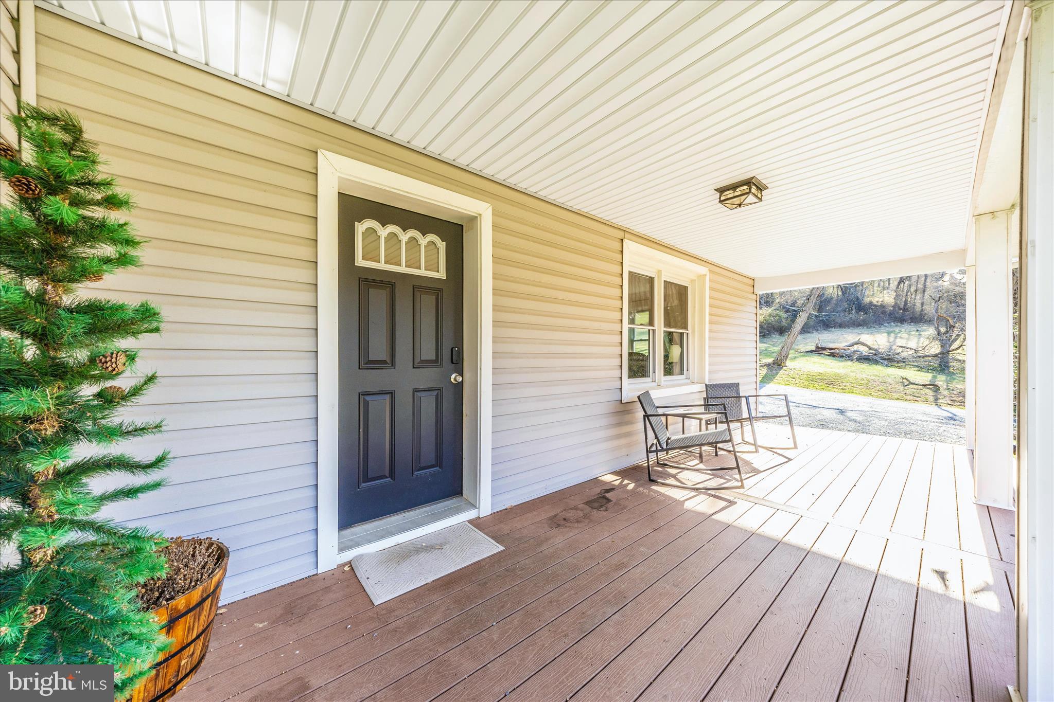 11863 Wolfsville Road Smithsburg, MD 21783 - Photo 41 of 51 a porch with seating space and hardwood floor