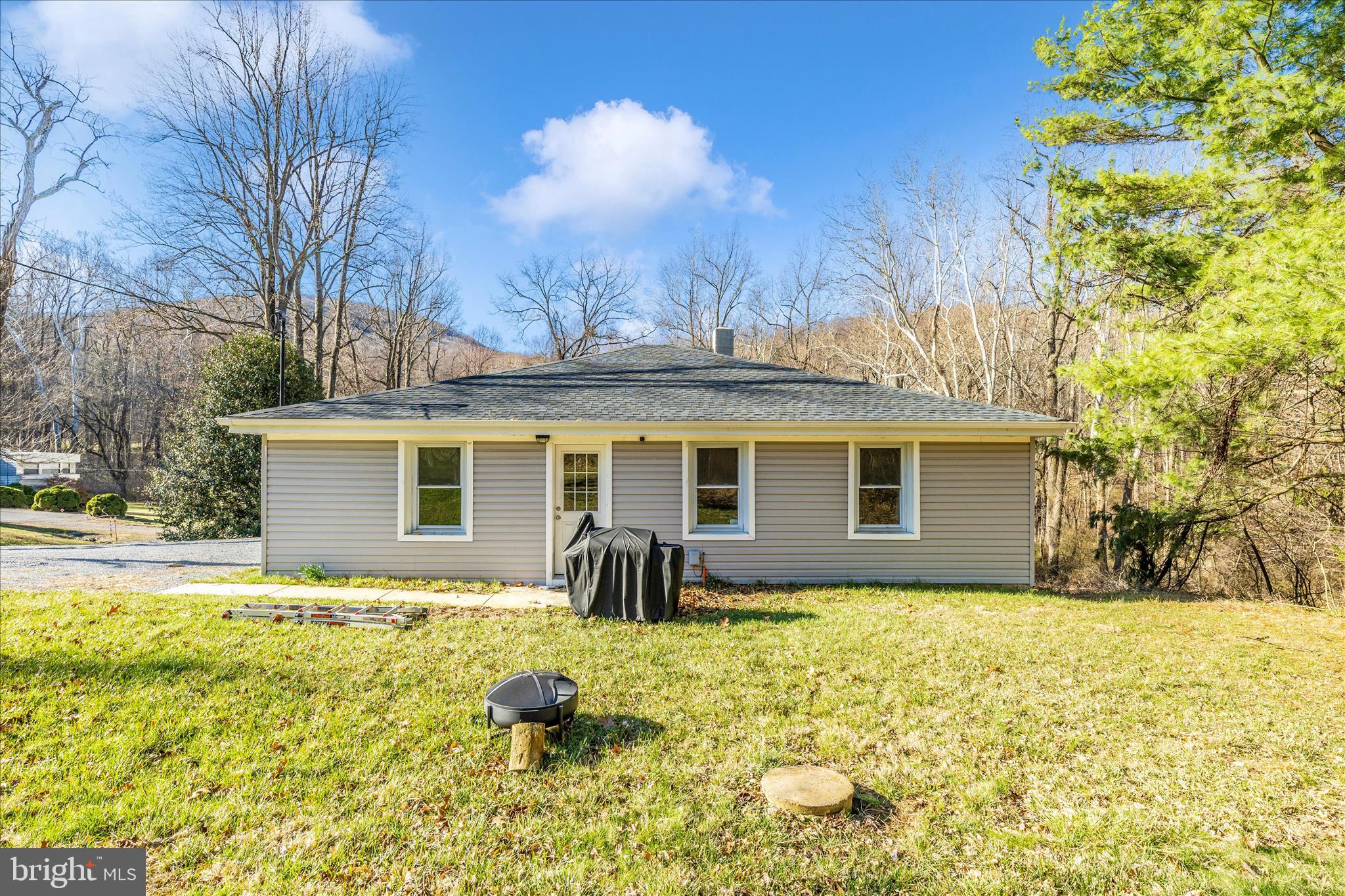 11863 Wolfsville Road Smithsburg, MD 21783 - Photo 47 of 51 a front view of house with yard and trees in the background