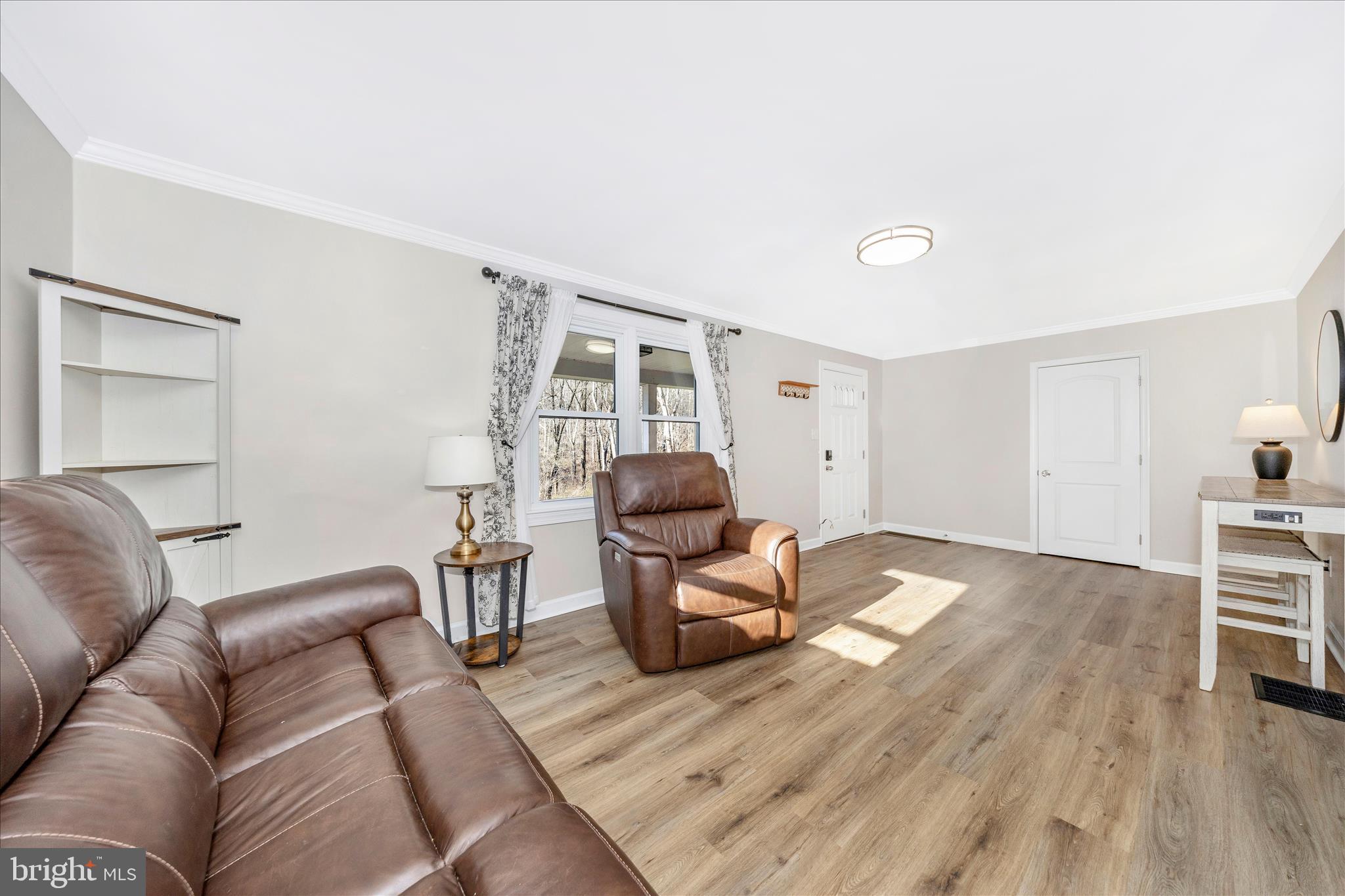 11863 Wolfsville Road Smithsburg, MD 21783 - Photo 5 of 51 a living room with furniture and a wooden floor