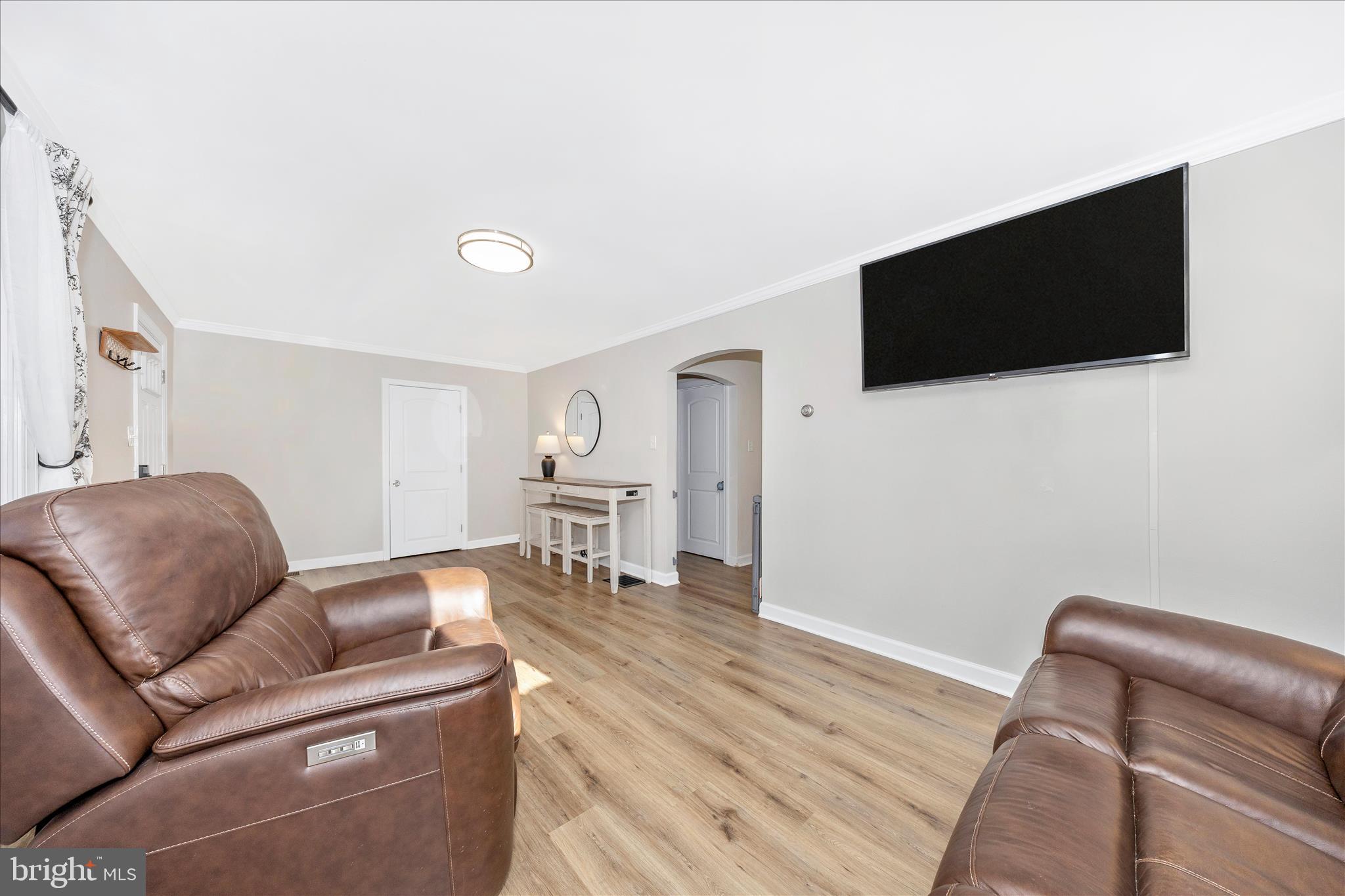 11863 Wolfsville Road Smithsburg, MD 21783 - Photo 6 of 51 a living room with furniture and a flat screen tv