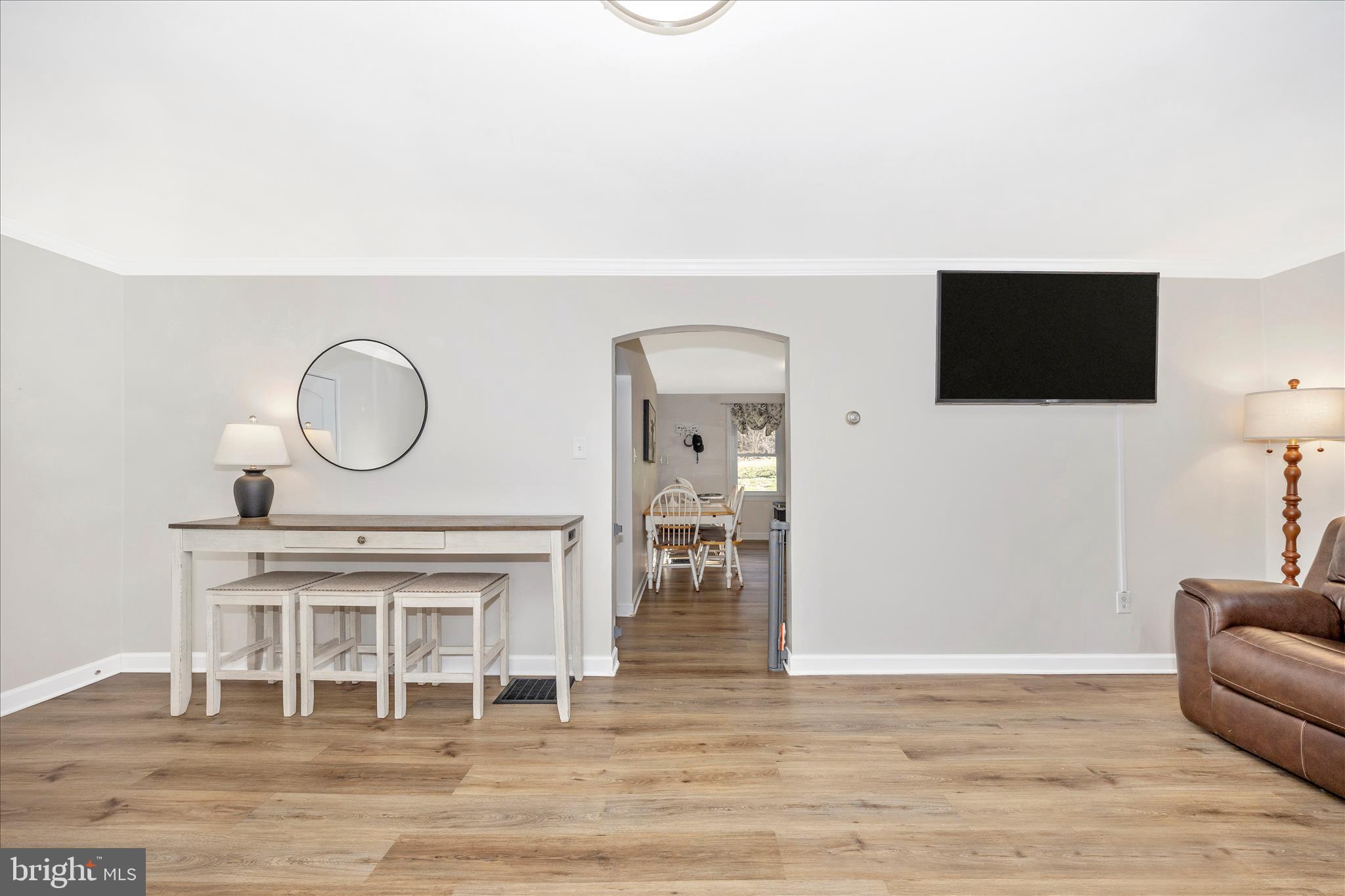 11863 Wolfsville Road Smithsburg, MD 21783 - Photo 7 of 51 a living room with furniture a flat screen tv and a fireplace