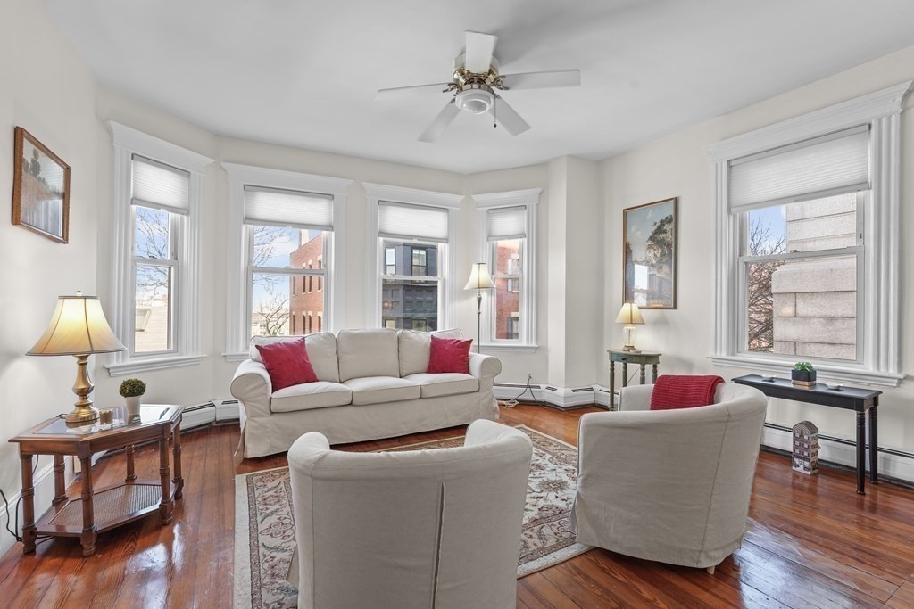 6-8 Bartlett Street, Unit 3 Boston, MA 02129 - Photo 1 of 13 a living room with furniture and window