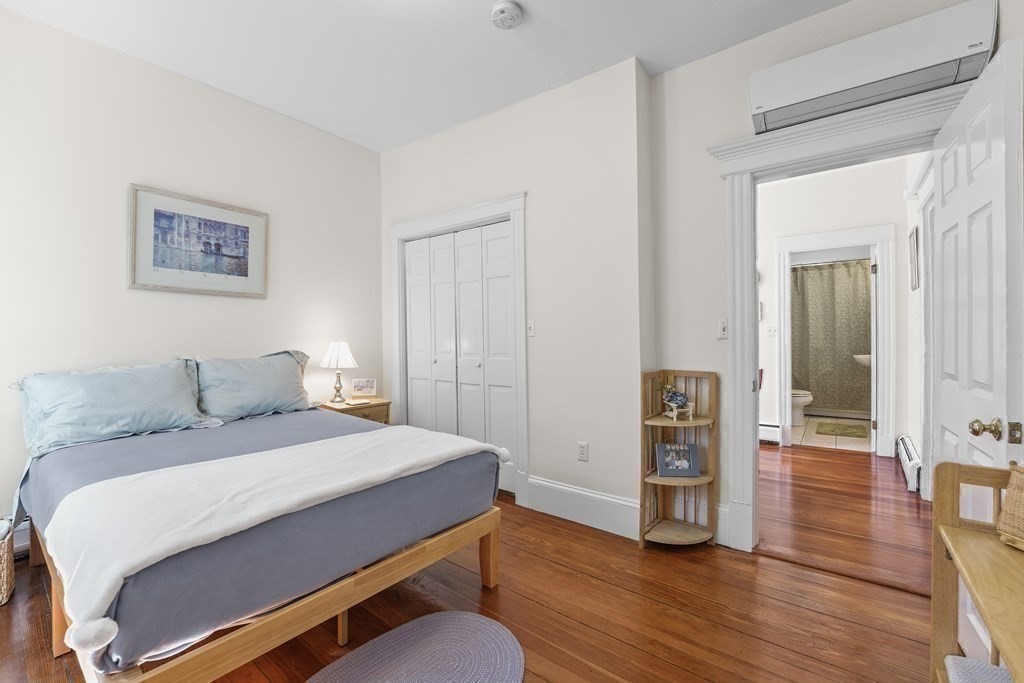 6-8 Bartlett Street, Unit 3 Boston, MA 02129 - Photo 11 of 13 a room with a bed and a view of bedroom
