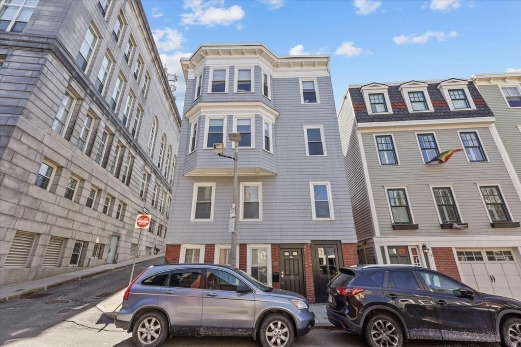 6-8 Bartlett Street, Unit 3 Boston, MA 02129 - Photo 13 of 13 a front view of a residential apartment building with parking space