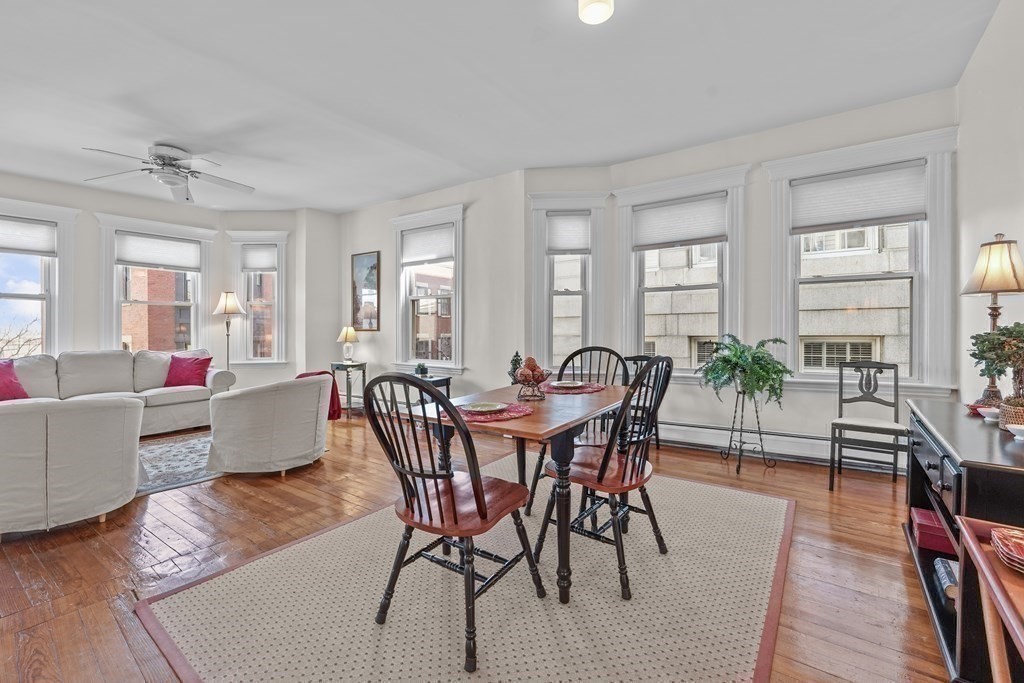 6-8 Bartlett Street, Unit 3 Boston, MA 02129 - Photo 5 of 13 a view of a dining room with furniture window and wooden floor