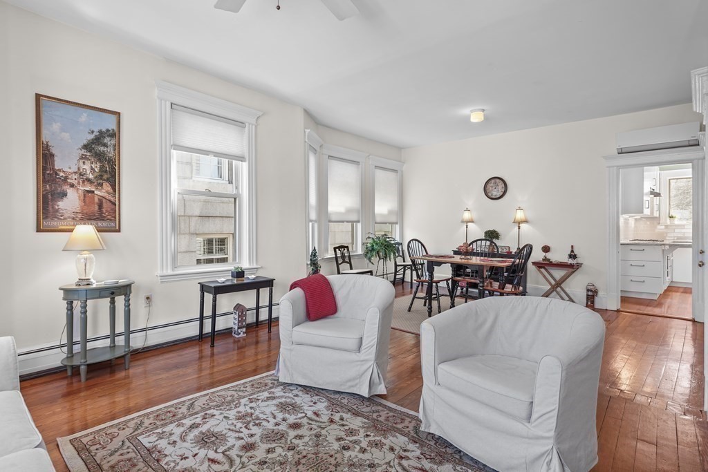 6-8 Bartlett Street, Unit 3 Boston, MA 02129 - Photo 6 of 13 a living room with furniture and a table