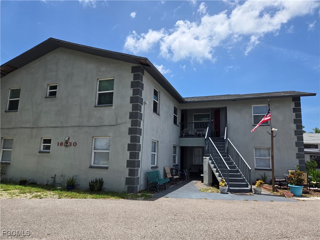 16930 Juanita Avenue Fort Myers, FL 33908 - Photo 6 of 6 a front view of a house with a yard