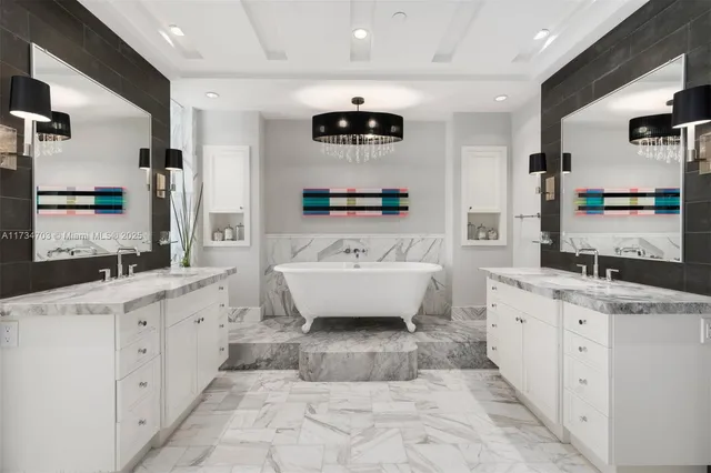 a bathroom with a double vanity sink a mirror and a bathtub