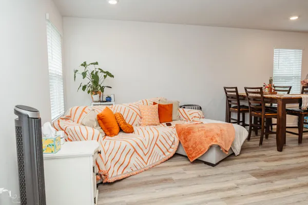 a bedroom with a bed and a table