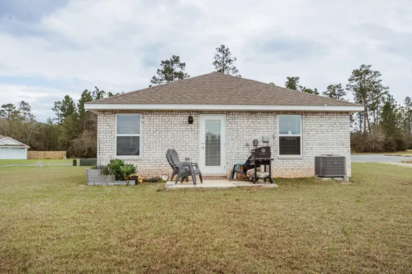 a front view of house with yard and seating