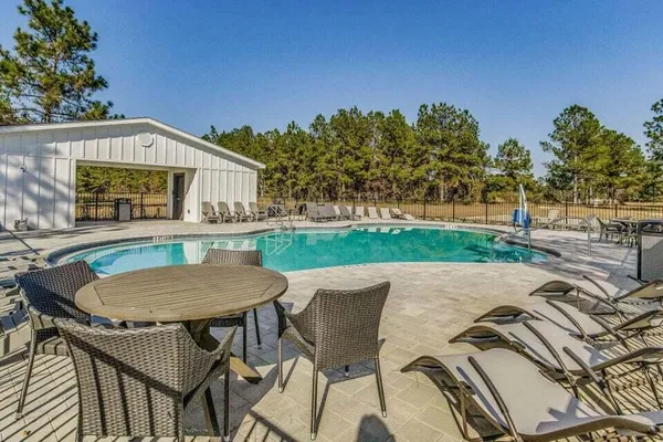 a view of a chairs and table in the patio