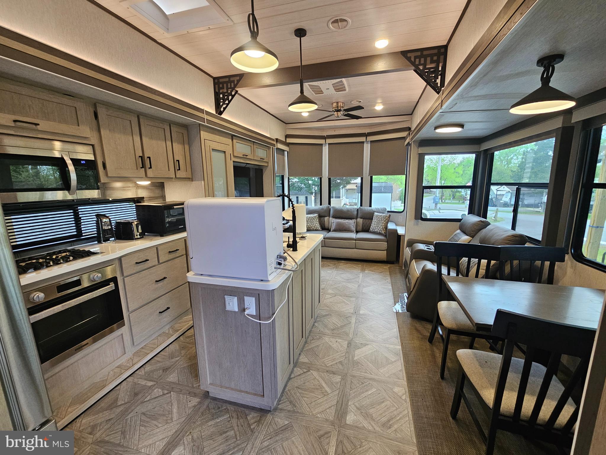 11 Ranger Road Falling Waters, WV 25419 - Photo 21 of 48 a kitchen with stainless steel appliances granite countertop a stove and a view of living room