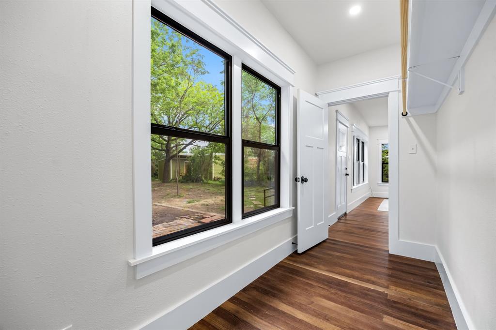 1014 Bolivar Street Denton, TX 76201 - Photo 24 of 36 a view of a hallway with wooden floor and door