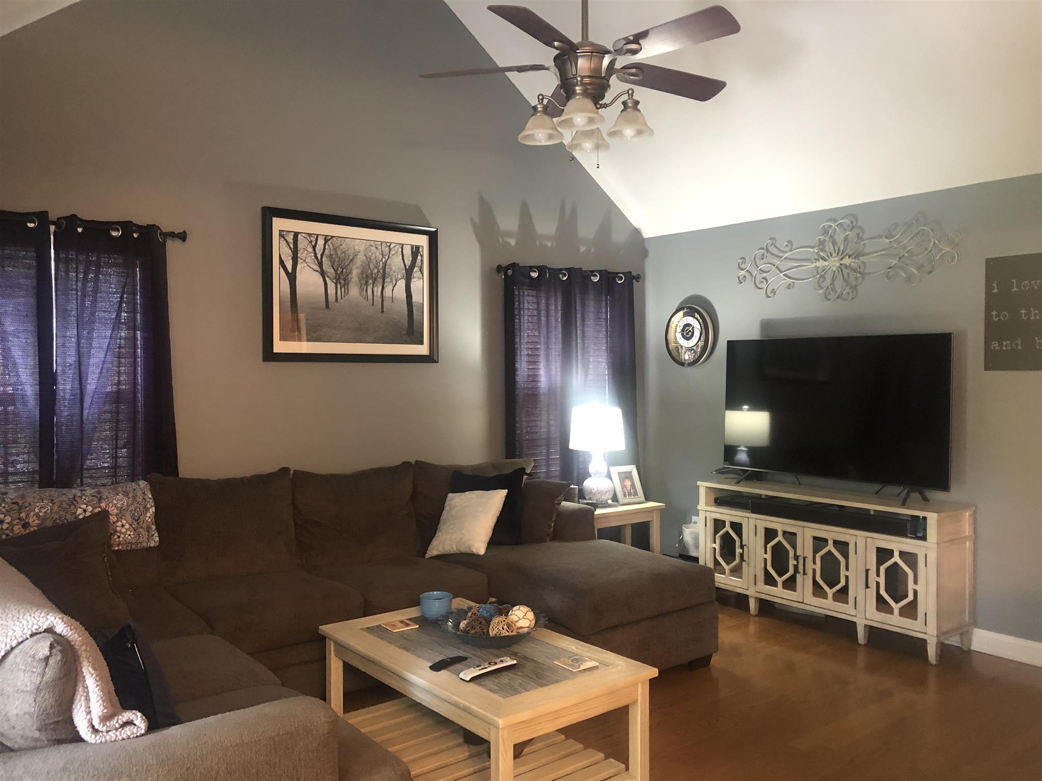 478 Jim Courtney Road Portland, TN 37148 - Photo 11 of 17 a living room with furniture and a flat screen tv