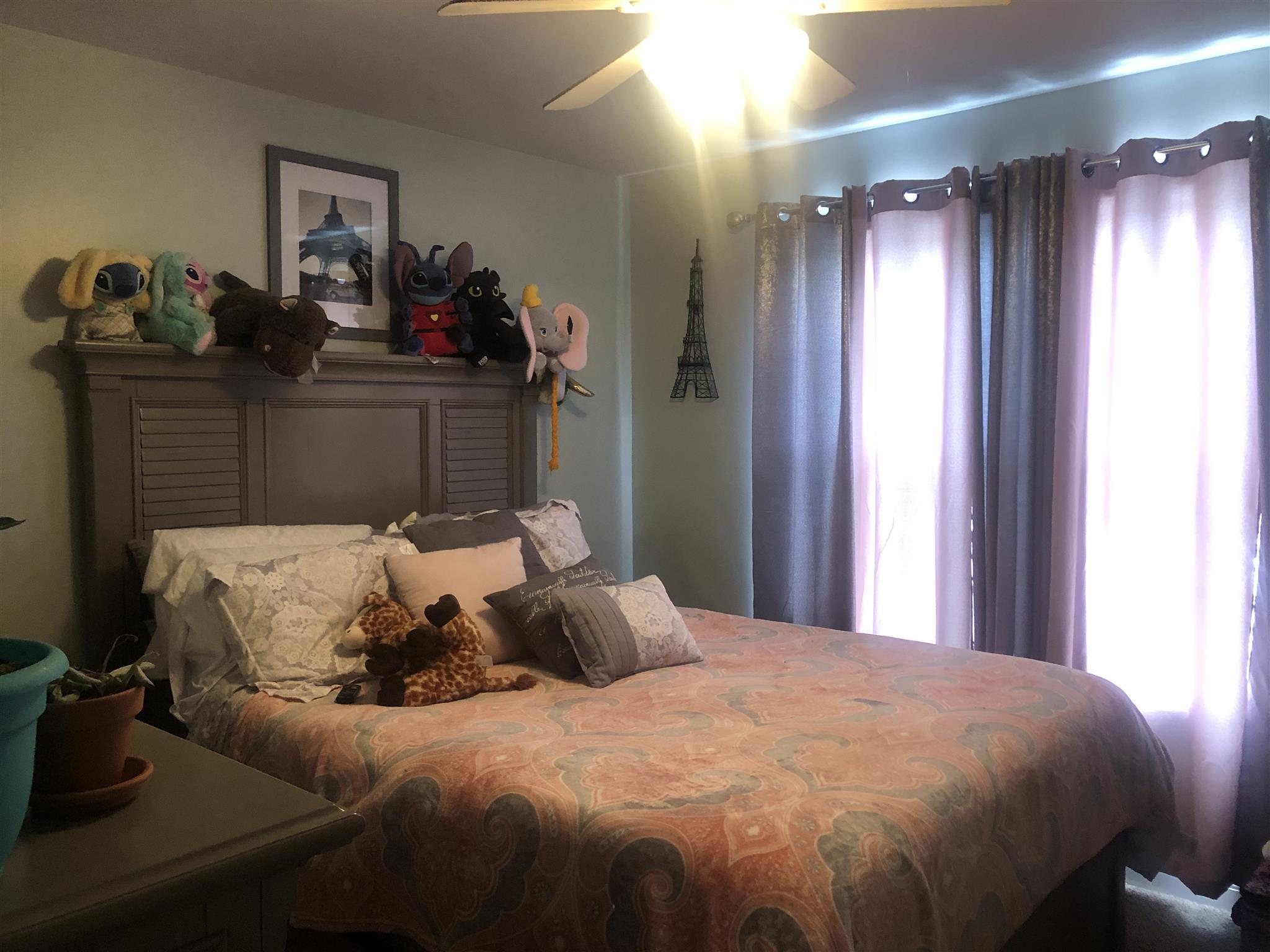 478 Jim Courtney Road Portland, TN 37148 - Photo 12 of 17 a bed sitting in a bedroom next to a window and a lamp