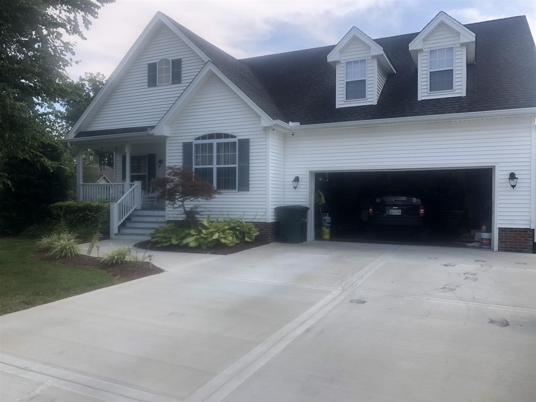 478 Jim Courtney Road Portland, TN 37148 - Photo 2 of 17 a front view of a house with a yard and garage
