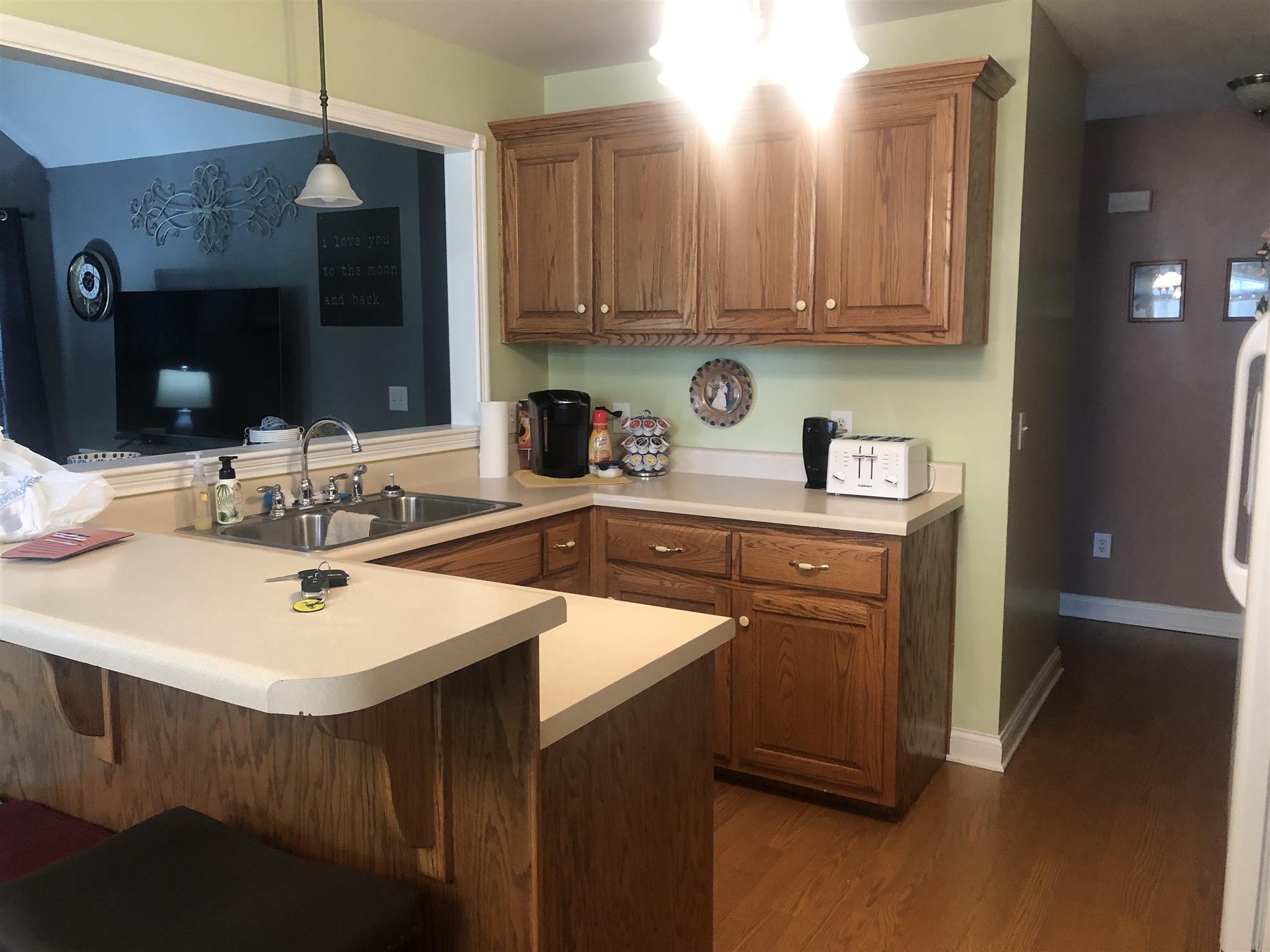 478 Jim Courtney Road Portland, TN 37148 - Photo 9 of 17 a kitchen with stainless steel appliances a sink a stove a refrigerator and cabinets