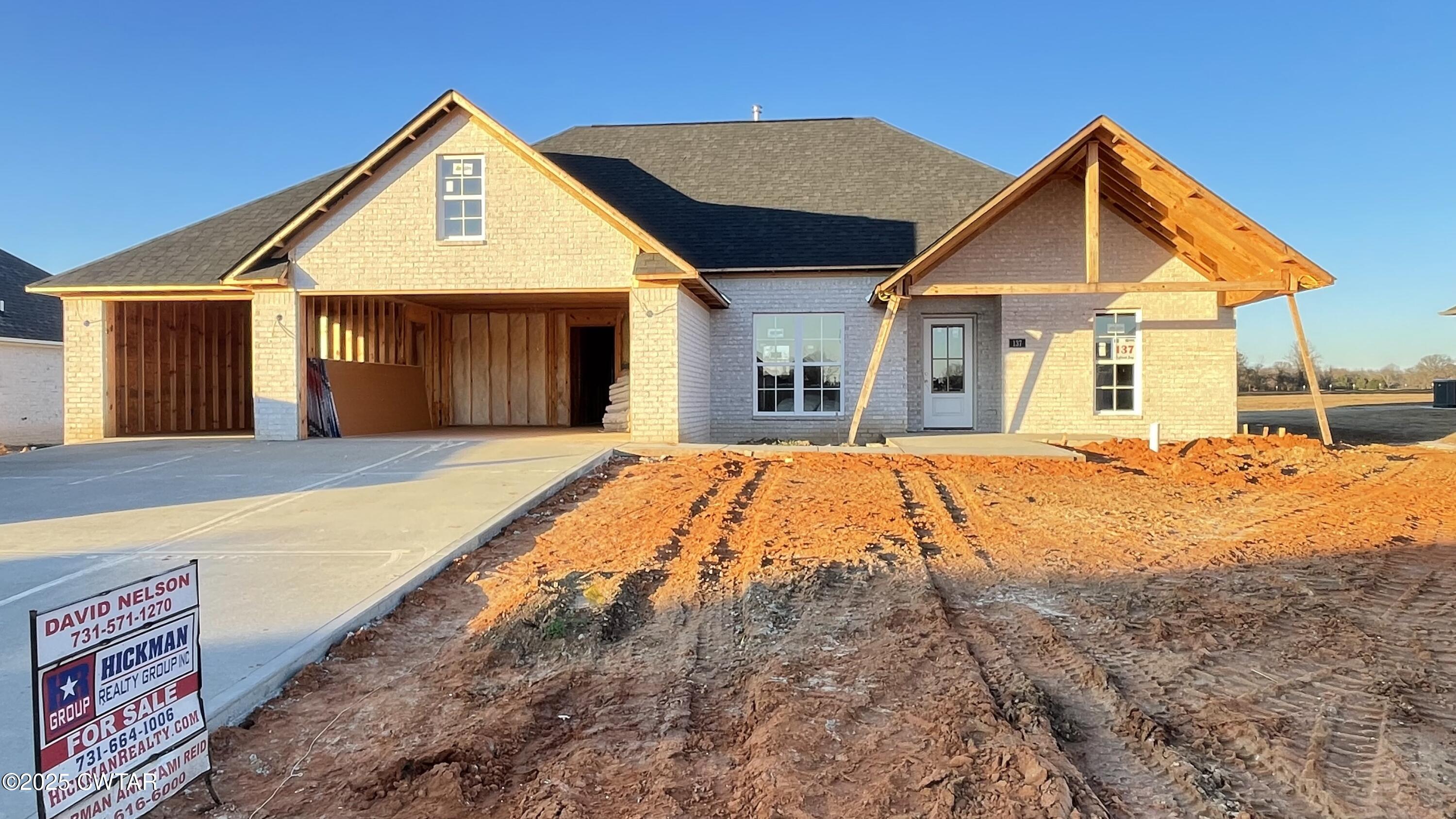 137 Daybreak Loop Medina, TN 38355 - Photo 4 of 5 a front view of a house with a yard
