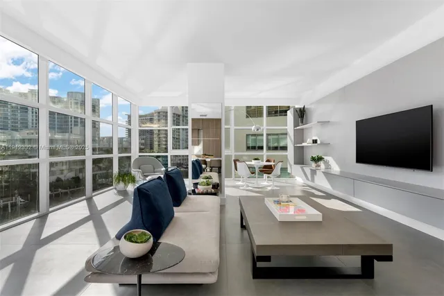 a living room with furniture and a flat screen tv