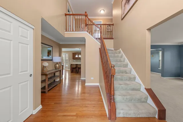 a view of entryway and hall with wooden floor