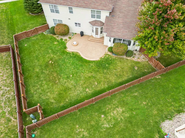 an aerial view of a house with a garden