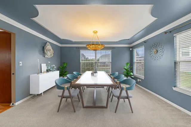a view of a dining room and a table and chairs