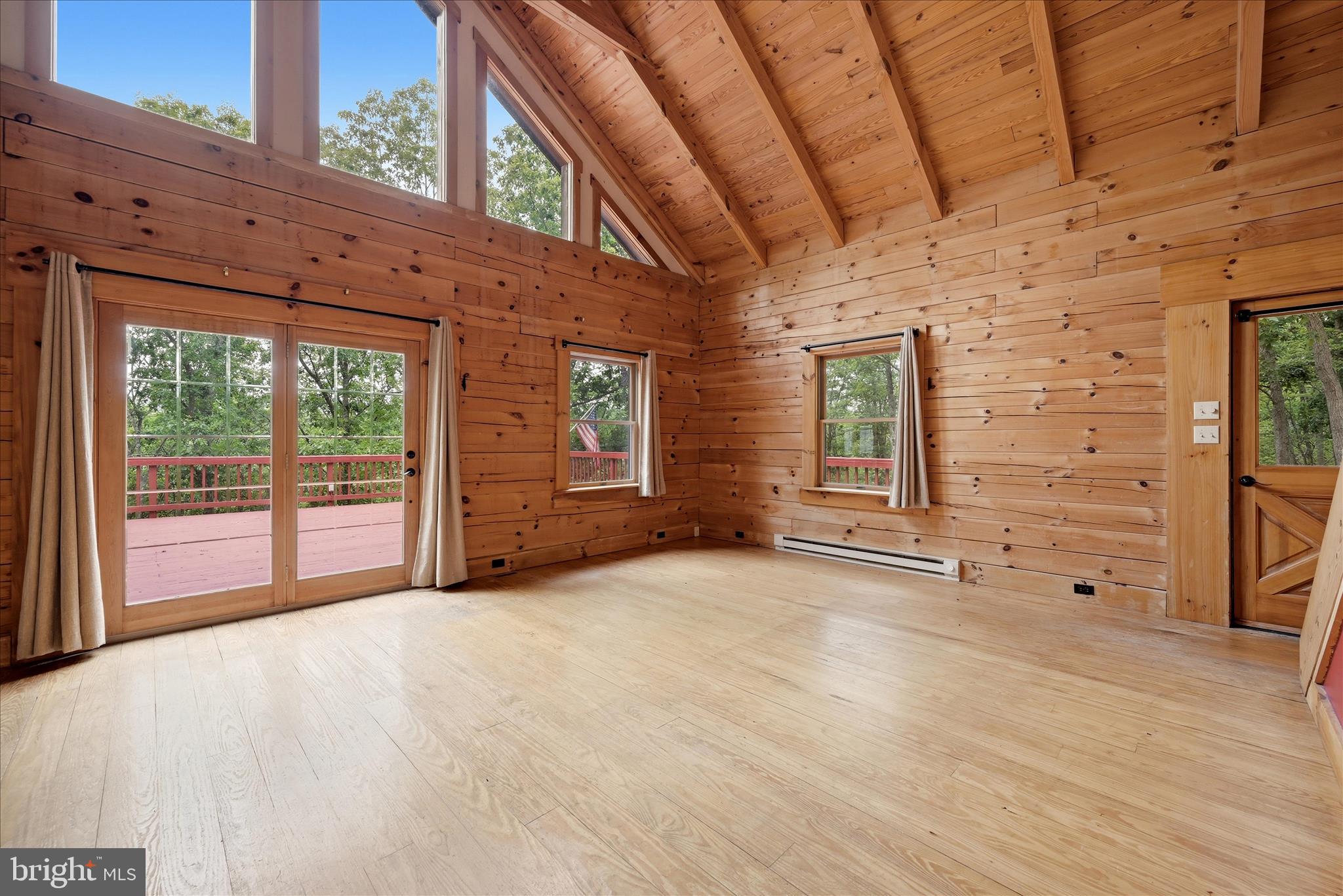 2858 Crossings View Road Paw Paw, WV 25434 - Photo 13 of 69 Living Room leads to door with massive deck