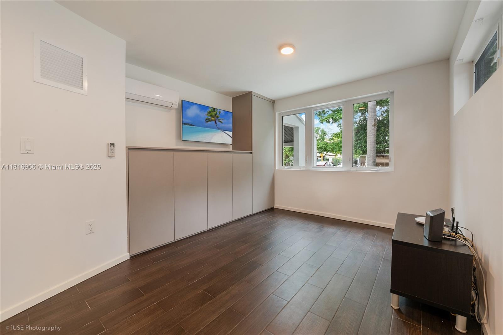 230 Ridgewood Road Coral Gables, FL 33133 - Photo 17 of 19 a view of a workspace with wooden floor and a window