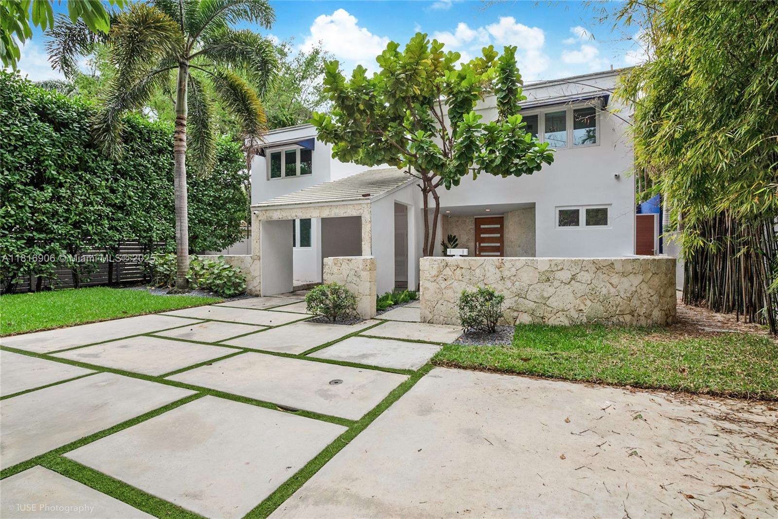 230 Ridgewood Road Coral Gables, FL 33133 - Photo 19 of 19 a front view of a house with a garden