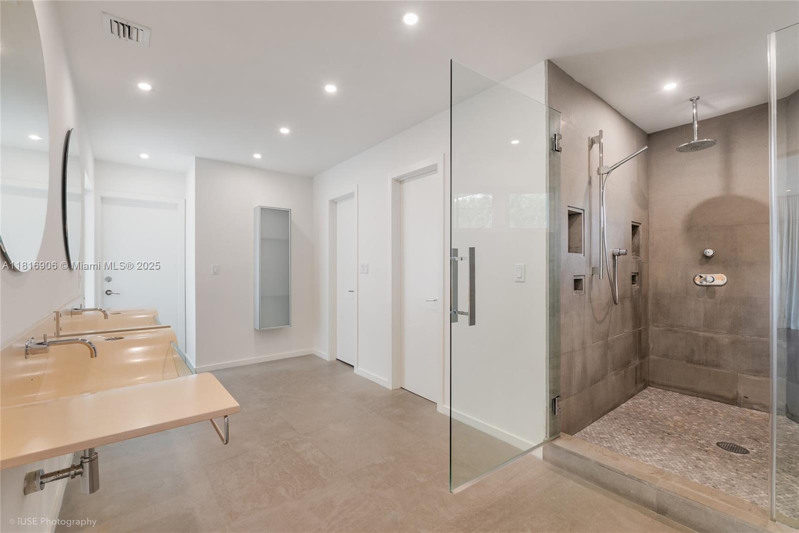 230 Ridgewood Road Coral Gables, FL 33133 - Photo 7 of 19 a bathroom with a shower and a sink