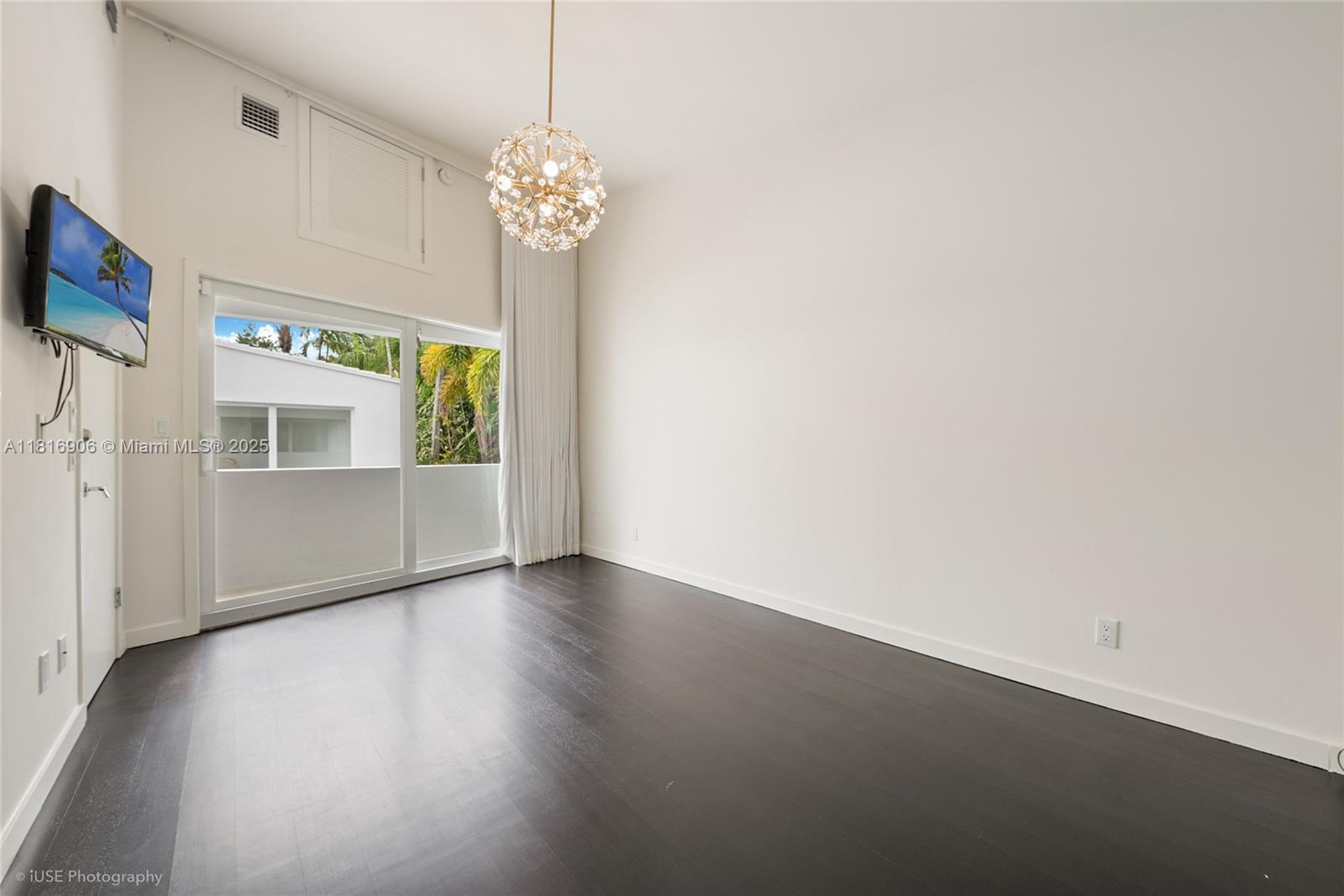 230 Ridgewood Road Coral Gables, FL 33133 - Photo 10 of 19 a view of an empty room with a window
