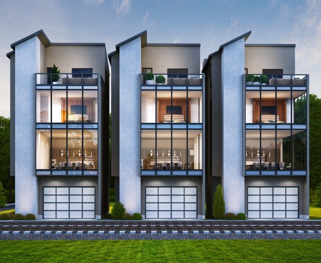 Modern Patio Homes with sleek, geometric designs. Each unit features large glass windows and balconies, providing ample natural light. The homes have attached garages and are surrounded by greenery, offering a blend of contemporary style and nature.