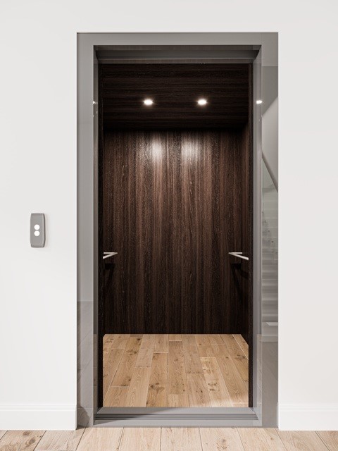 1222 Winter Street Houston, TX 77007 - Photo 3 of 13 This photo shows a modern home elevator with a sleek design featuring dark wood paneling, recessed lighting, and hardwood flooring, perfect for convenient multi-level access. Virtually Staged.