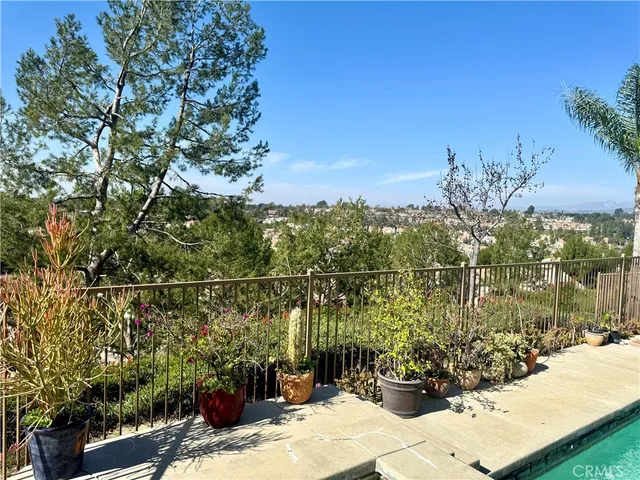 a view of a patio with a table and chairs