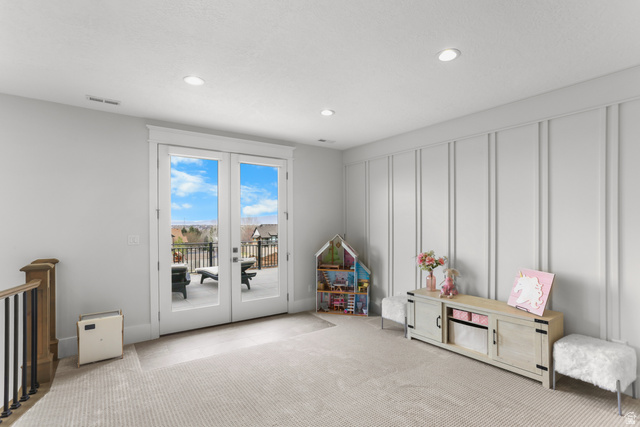 1354 South 800 East Mapleton, UT 84664 - Photo 45 of 129 Playroom with a decorative wall, french doors, light colored carpet, and recessed lighting