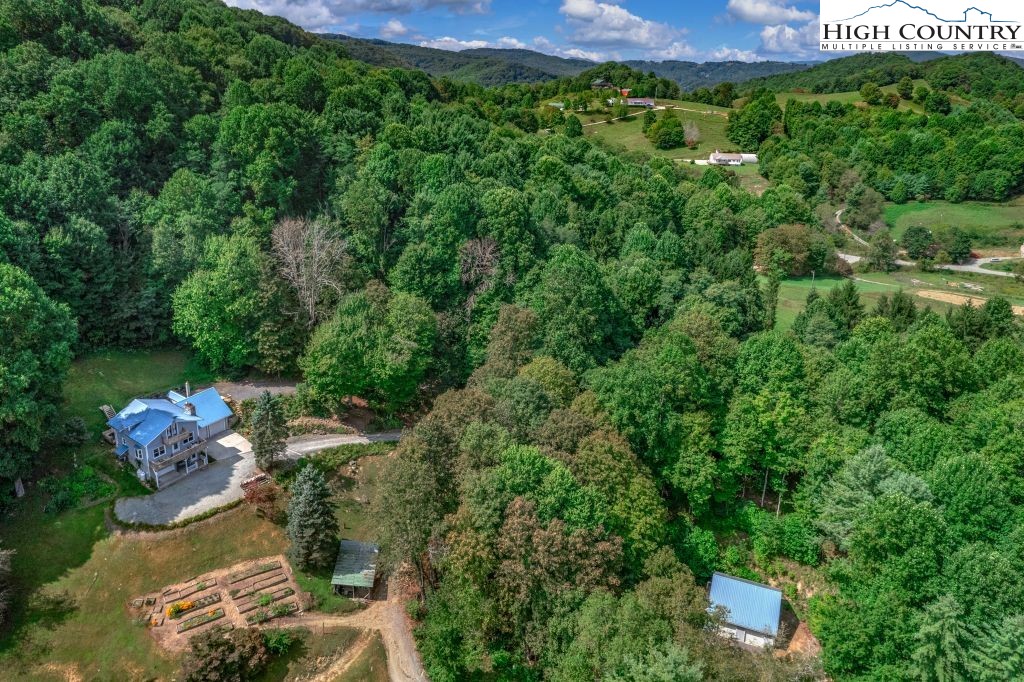 1005 Andy Hicks Road Banner Elk, NC 28604 - Photo 2 of 44 an aerial view of a house with a yard