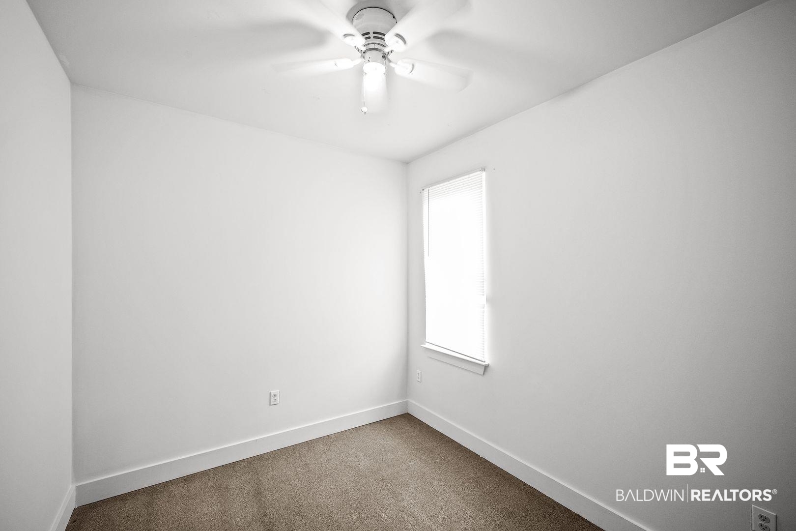 635 East Azalea Avenue Foley, AL 36535 - Photo 8 of 18 Room featuring light-colored carpeting and white walls