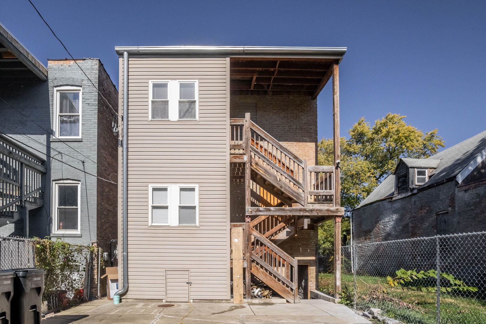4837 West Monroe Street, Unit 2 Chicago, IL 60644 - Photo 21 of 21 a front view of a house with plants