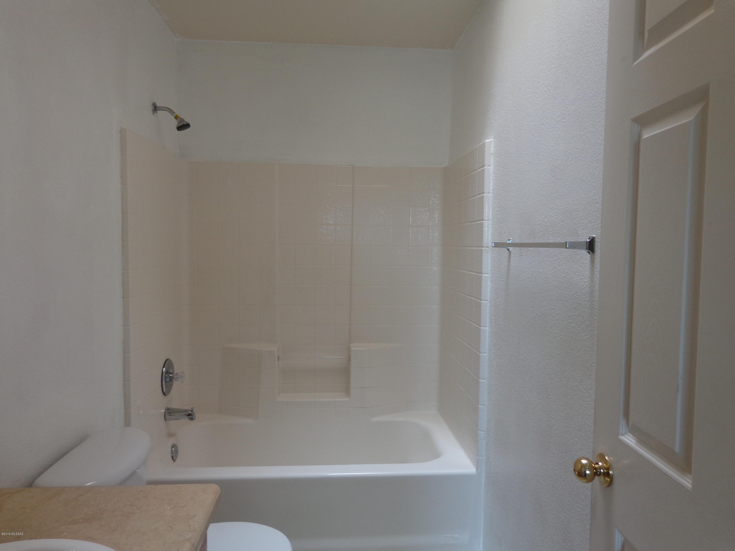 1223 Yave Court Rio Rico, AZ 85648 - Photo 8 of 15 a bathroom with a bathtub