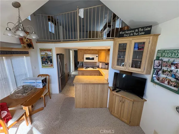 a kitchen with stainless steel appliances granite countertop a refrigerator and a stove