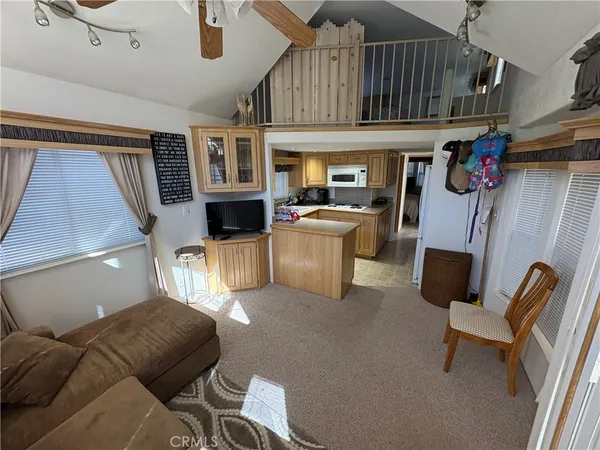 a kitchen with a refrigerator and a sink