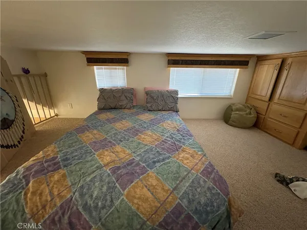 a view of living room with furniture and a window